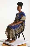  Dina Moses  1 dressed sitting traditional decora long african dress whole body 0008.jpg